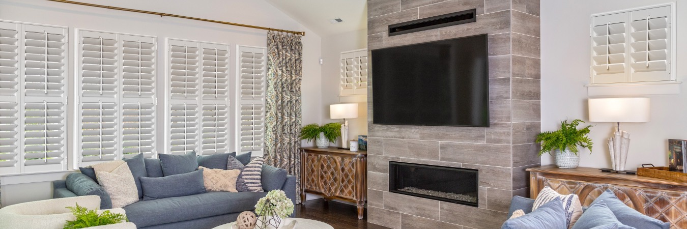 Interior shutters in Grosse Pointe living room with fireplace