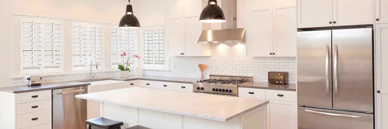 White polywood shutters in a sleek kitchen.
